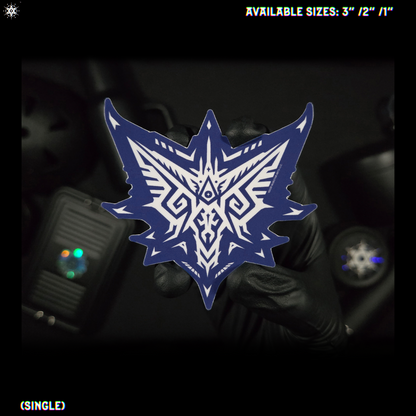 A blue and white geometric tribal-style shield-shaped sticker held by a gloved hand against a dark background, with text reading 'AVAILABLE SIZES: 3" / 2" / 1"' and '(SINGLE)' in the corners.