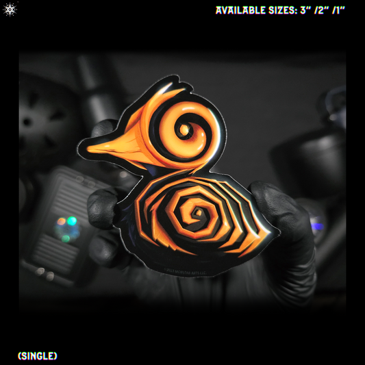 A gloved hand holding a single decorative sticker design of a duck with a spiral and geometric pattern in orange/yellow, and black/blue. Text at the top says available sizes 3" / 2" / 1" and text at the bottom says single.