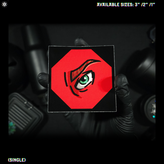Hand holding a red square with an eye design against a dark background